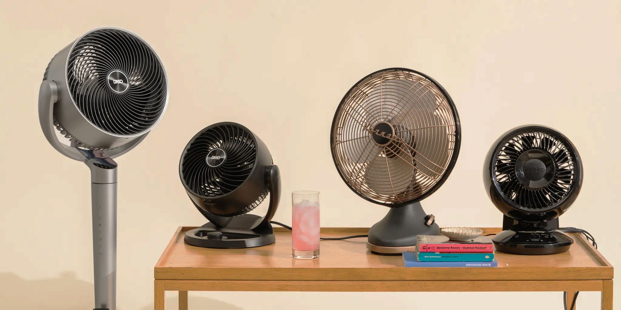 Four desk fans posing on a table