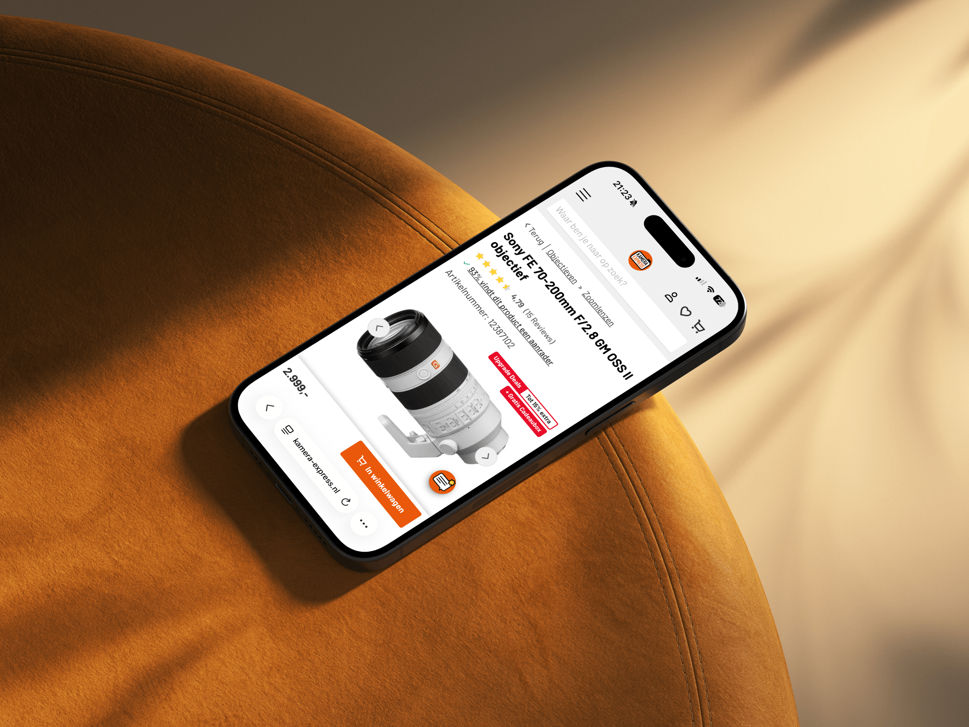 An iphone laying on a chair displaying the UI of Kamera Express