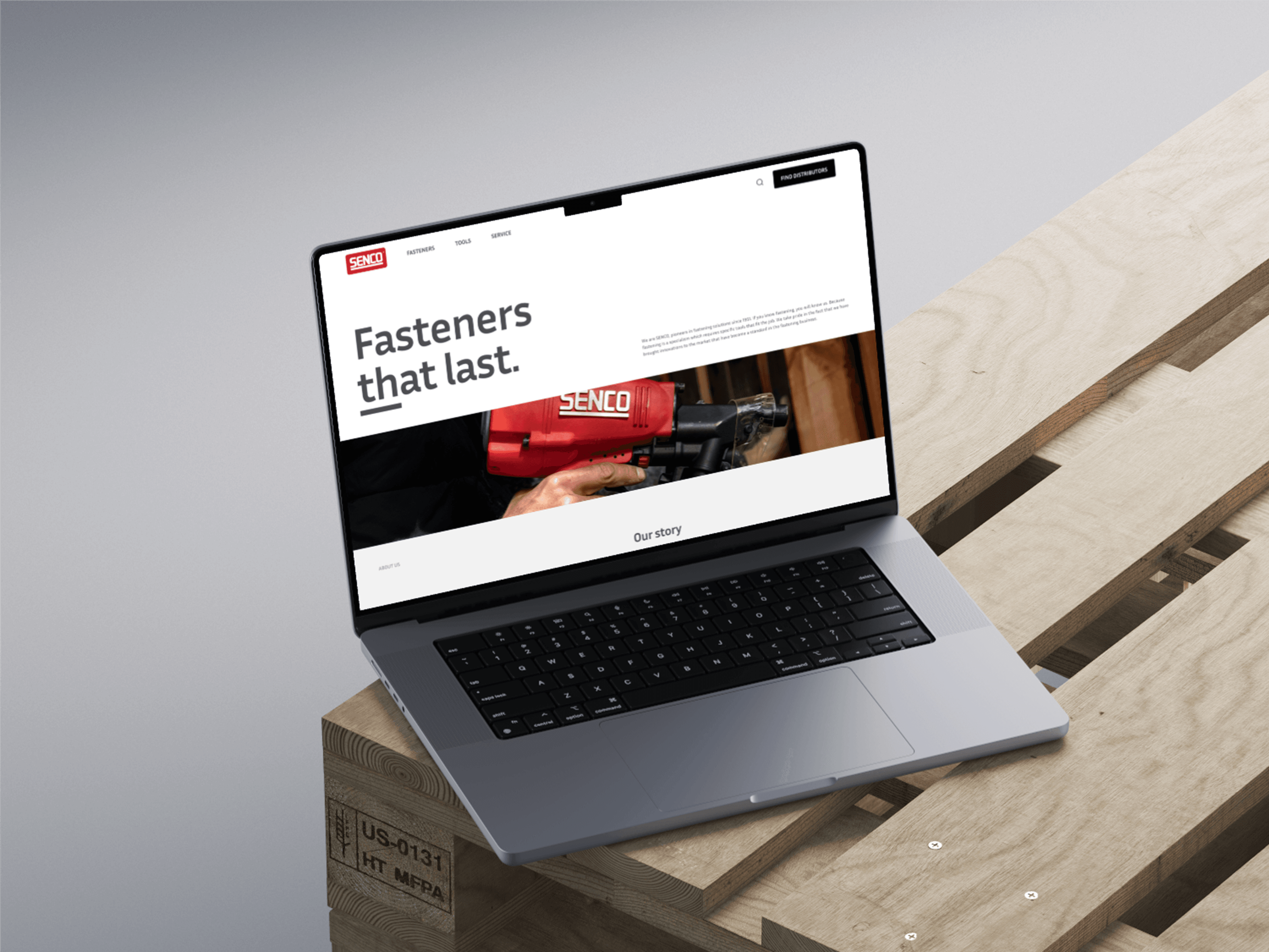 A laptop displaying the Senco website concept: "Fasteners that last" beside a photograph of someone driving a red Senco tool into timber, with Fasteners, Tools and Service in the navigation