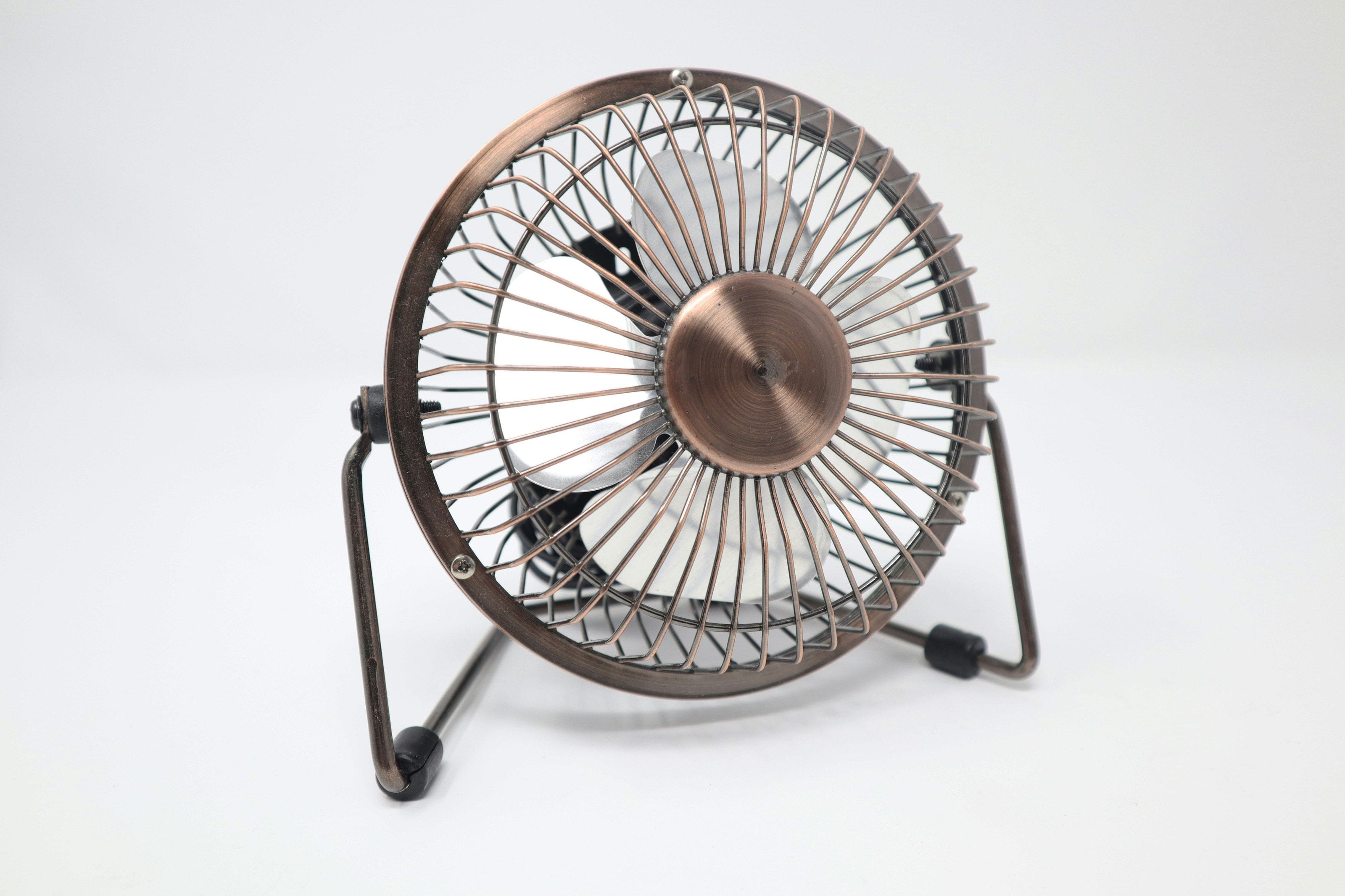 Copper desk fan on white